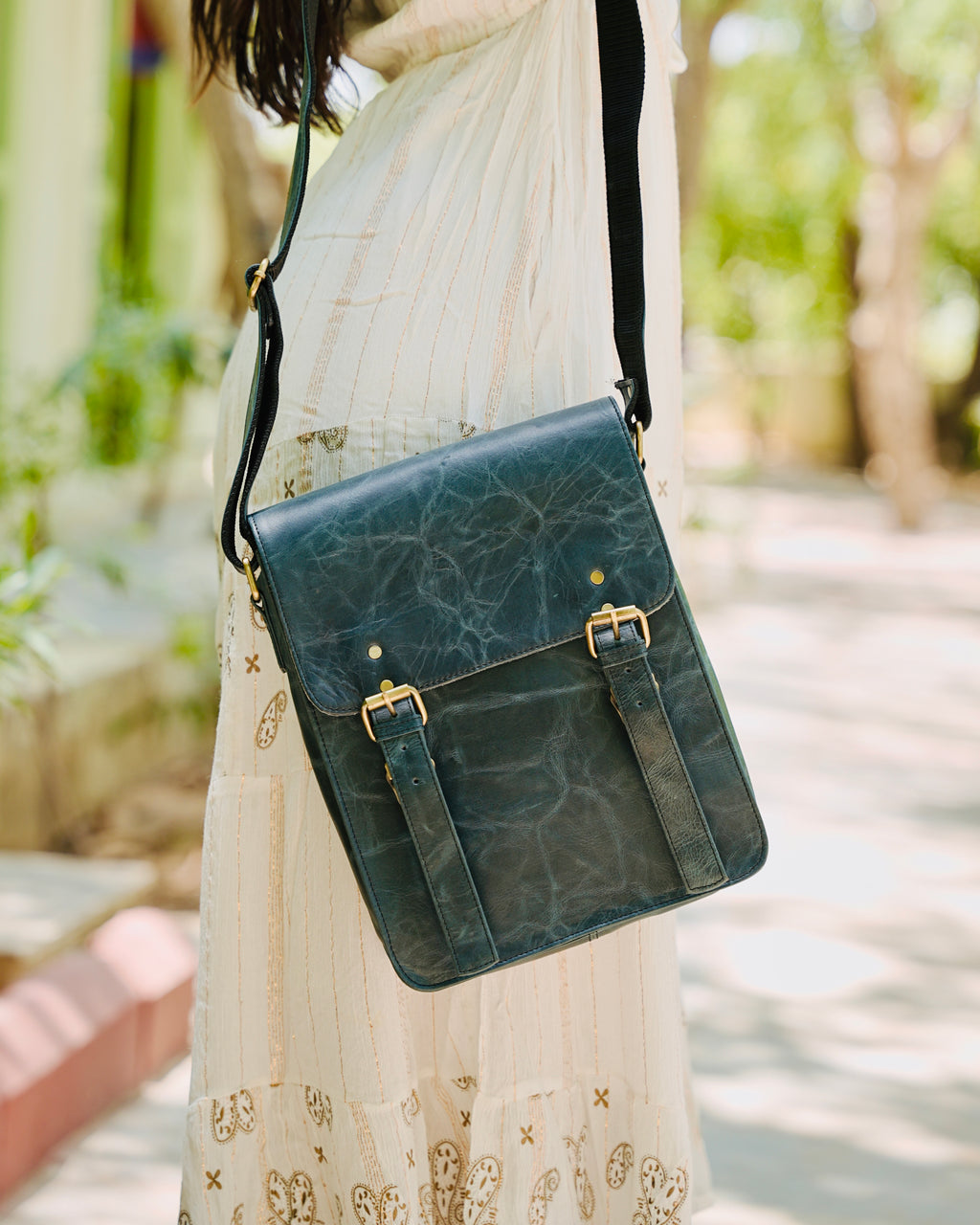 blue 100% buffalo leather messenger back with utility and aesthetic looks