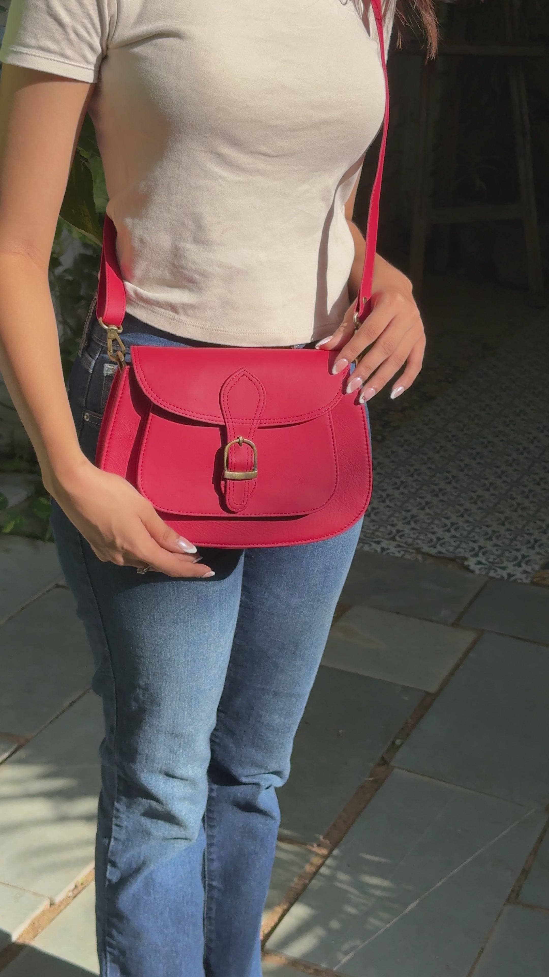 Red leather bag with gold buckle and a detachable strap and multipurpose and multi utility and 100% buffalo leather